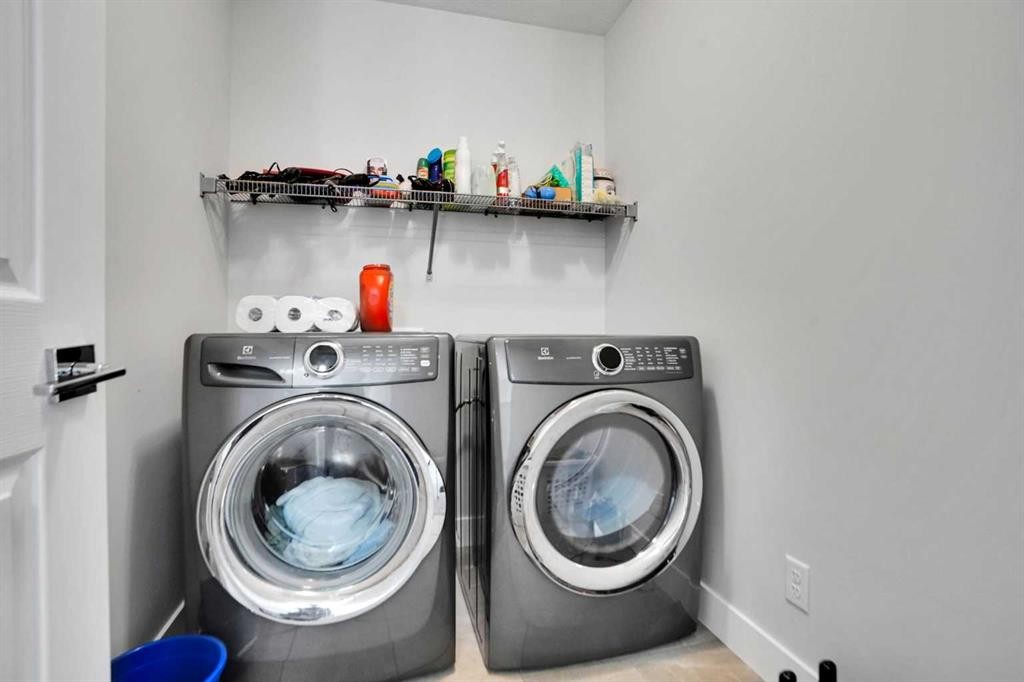 3 Rivercrest Common, Cochrane, AB - Indoor Photo Showing Laundry Room