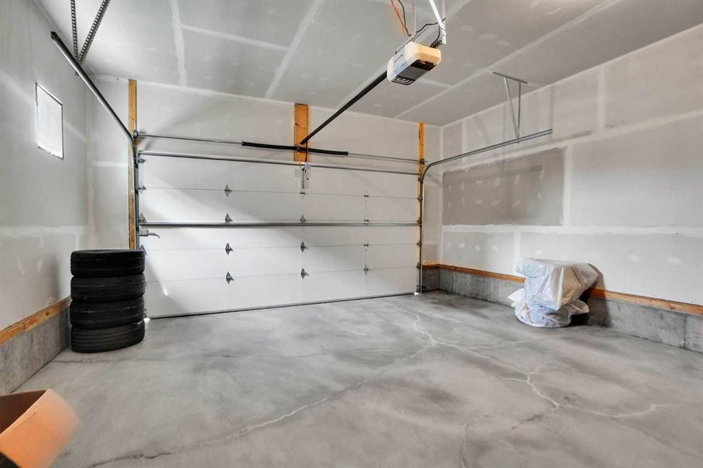 3 Rivercrest Common, Cochrane, AB - Indoor Photo Showing Garage