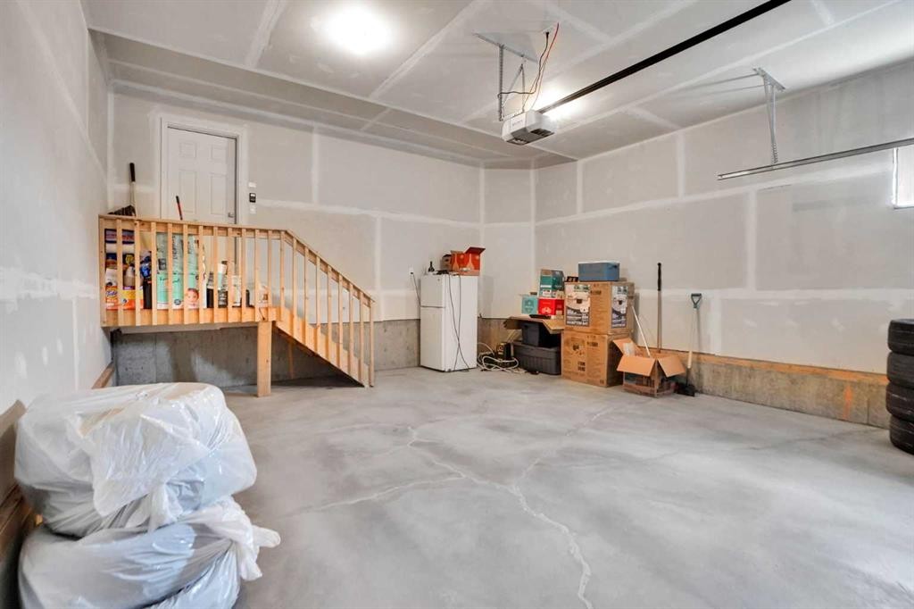 3 Rivercrest Common, Cochrane, AB - Indoor Photo Showing Garage