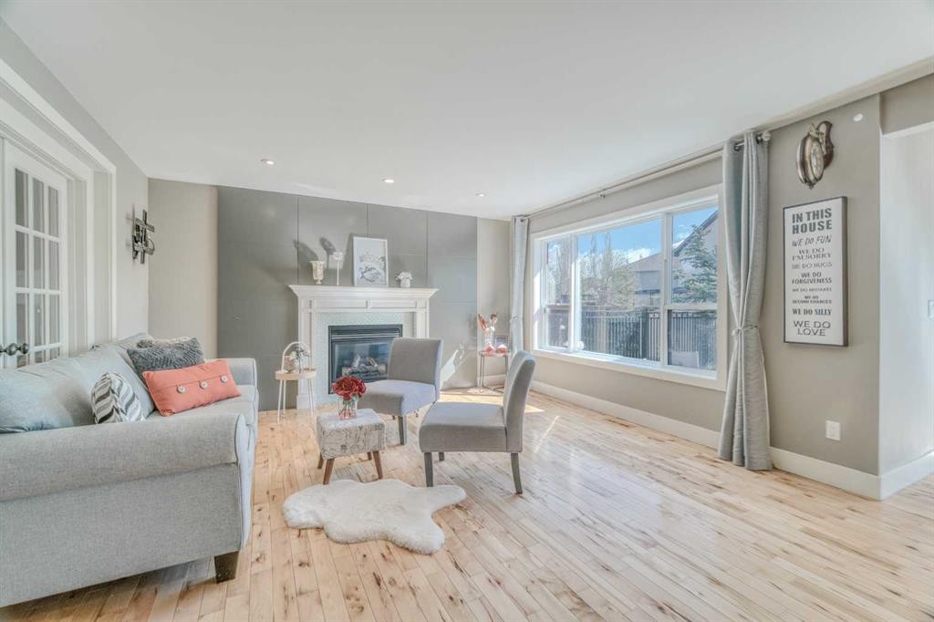 100 Royal Birch Crescent Nw, Calgary, AB - Indoor Photo Showing Living Room With Fireplace