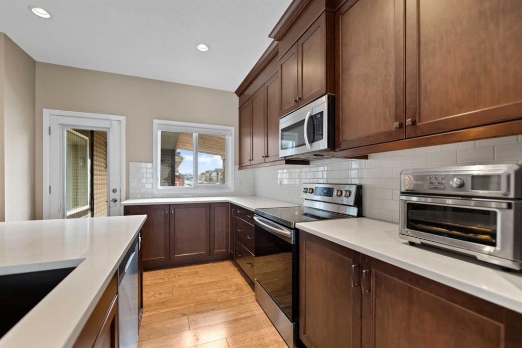 79 Cornerstone Passage Ne, Calgary, AB - Indoor Photo Showing Kitchen With Upgraded Kitchen