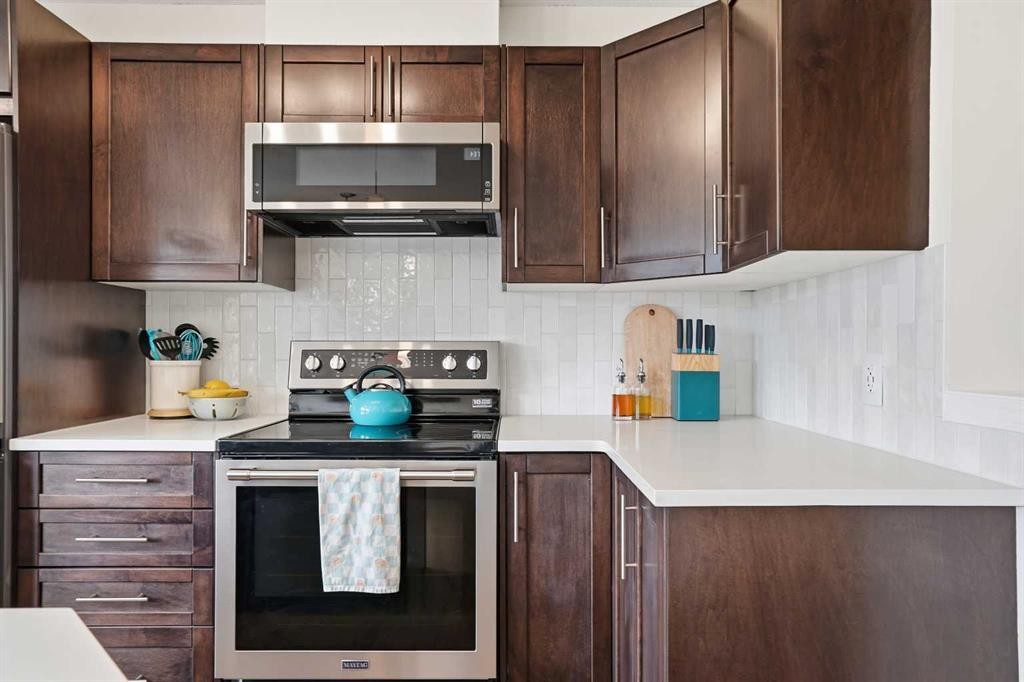 24 Auburn Crest Park Se, Calgary, AB - Indoor Photo Showing Kitchen With Stainless Steel Kitchen
