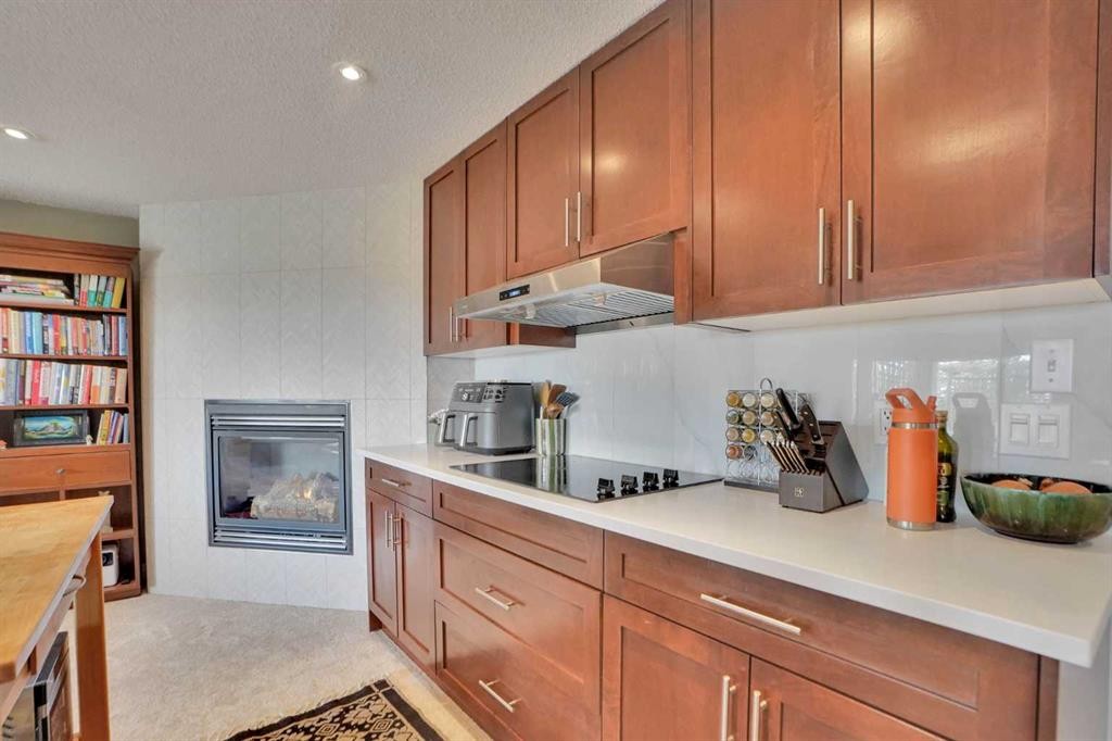 378 Patterson Boulevard Sw, Calgary, AB - Indoor Photo Showing Kitchen With Fireplace