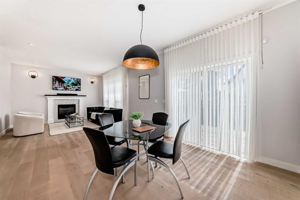 420 Legacy View Se, Calgary, AB - Indoor Photo Showing Dining Room With Fireplace