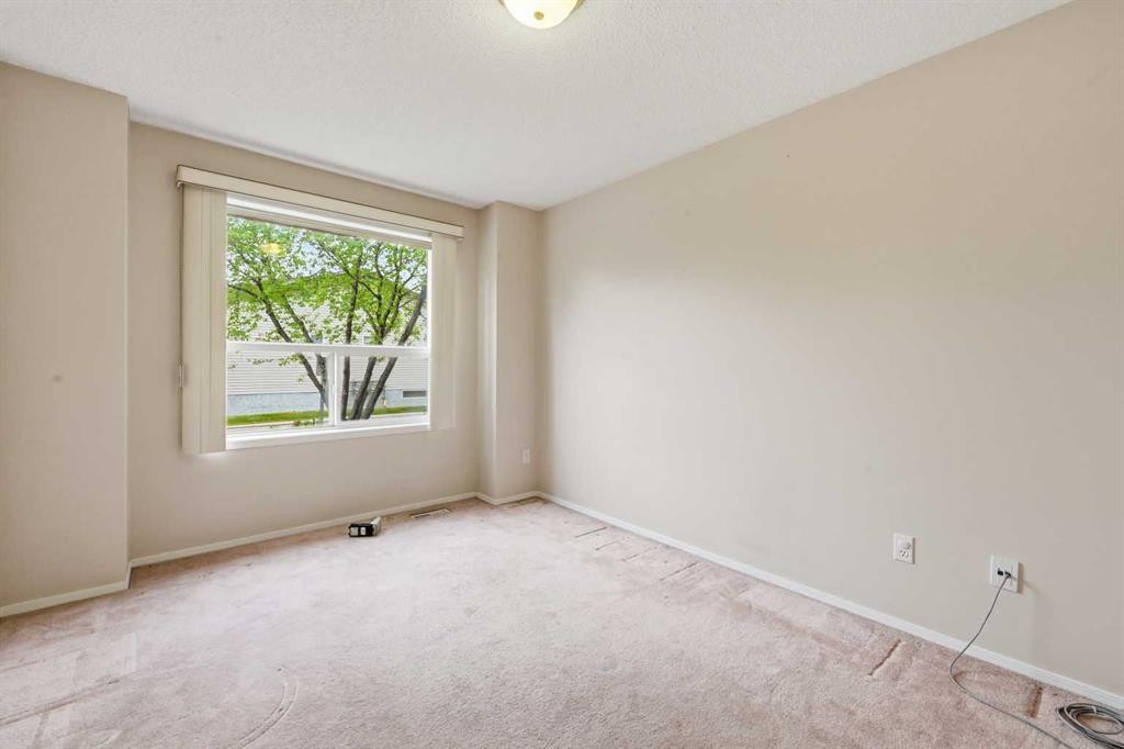 25 Tararidge Circle Ne, Calgary, AB - Indoor Photo Showing Other Room
