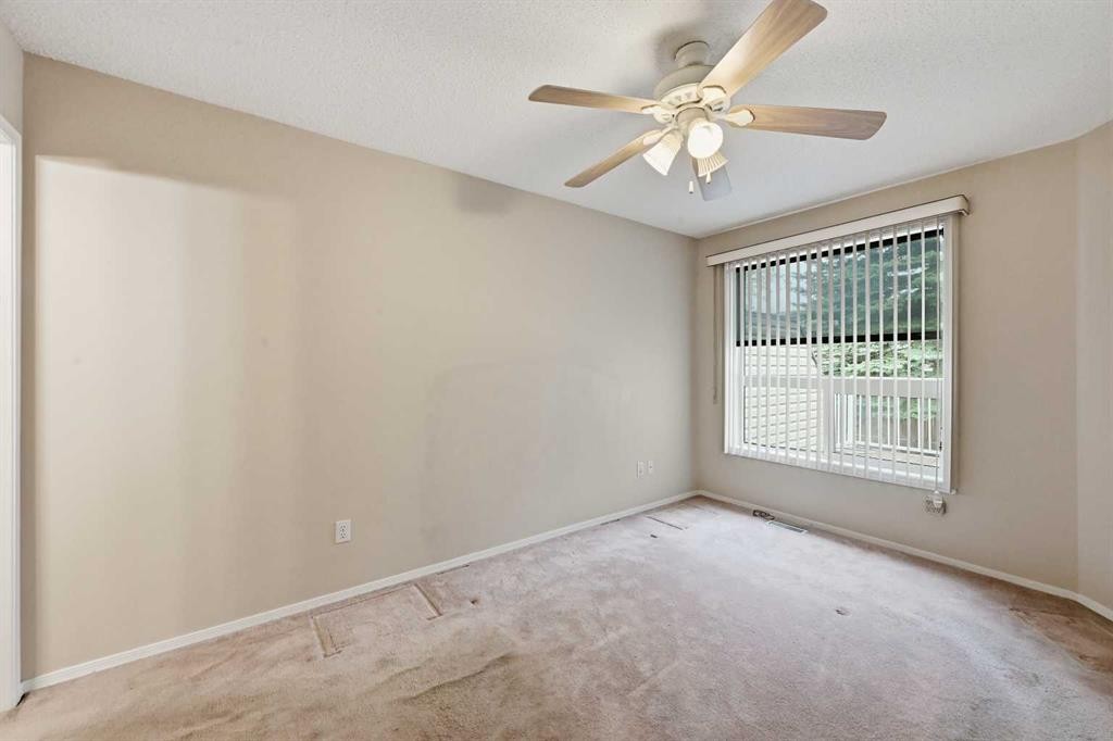 25 Tararidge Circle Ne, Calgary, AB - Indoor Photo Showing Other Room
