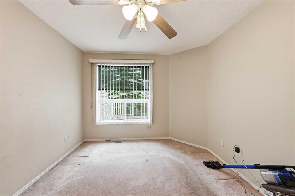 25 Tararidge Circle Ne, Calgary, AB - Indoor Photo Showing Other Room