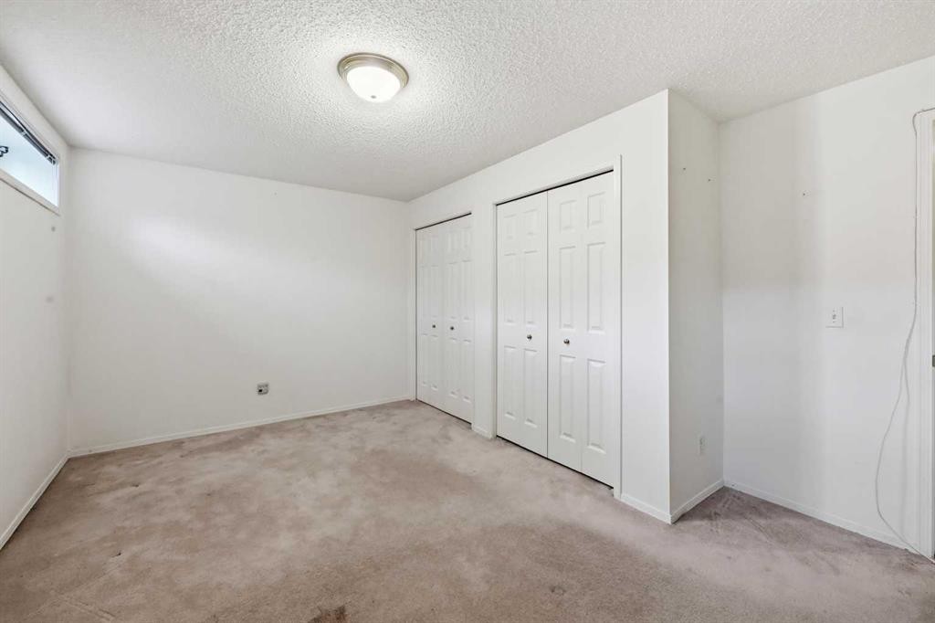 25 Tararidge Circle Ne, Calgary, AB - Indoor Photo Showing Other Room