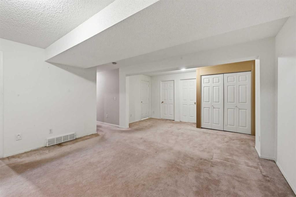 25 Tararidge Circle Ne, Calgary, AB - Indoor Photo Showing Other Room
