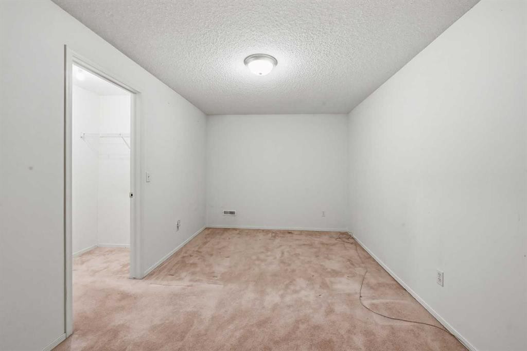 25 Tararidge Circle Ne, Calgary, AB - Indoor Photo Showing Other Room