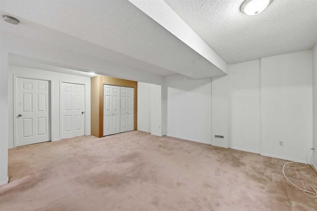 25 Tararidge Circle Ne, Calgary, AB - Indoor Photo Showing Other Room