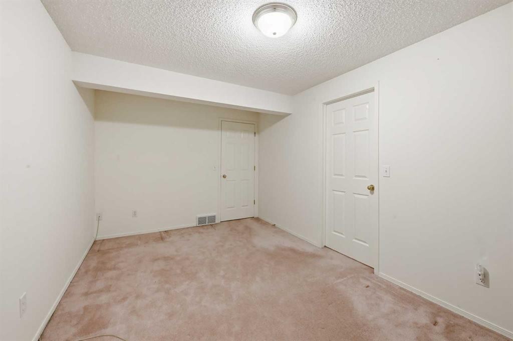 25 Tararidge Circle Ne, Calgary, AB - Indoor Photo Showing Other Room