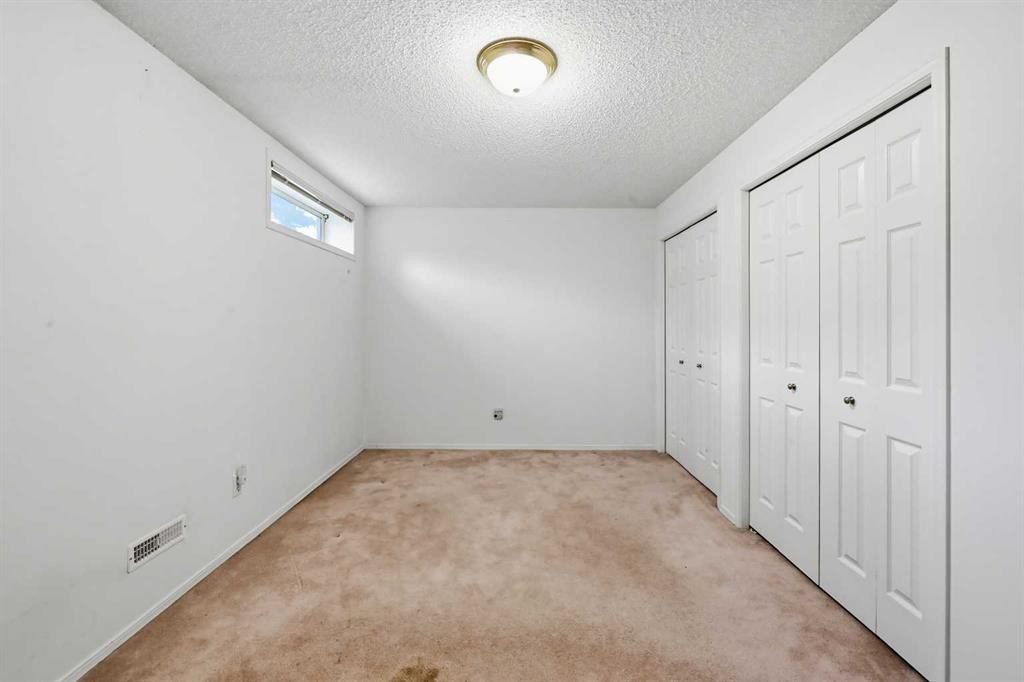 25 Tararidge Circle Ne, Calgary, AB - Indoor Photo Showing Other Room