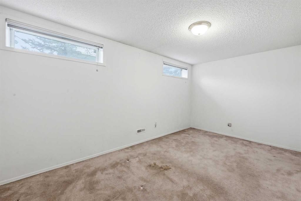 25 Tararidge Circle Ne, Calgary, AB - Indoor Photo Showing Other Room