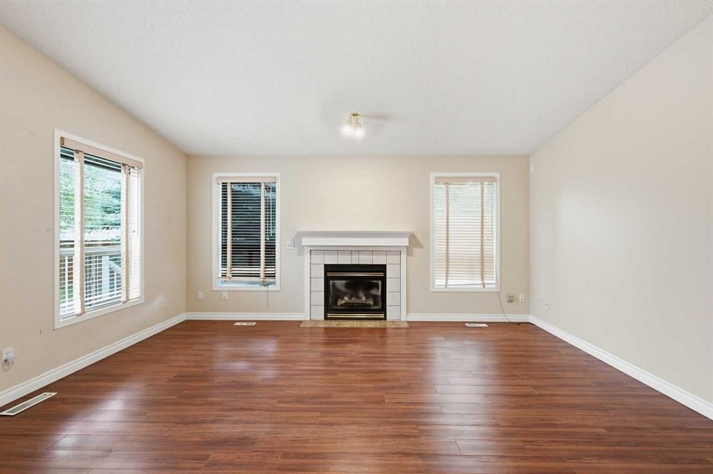 25 Tararidge Circle Ne, Calgary, AB - Indoor Photo Showing Living Room With Fireplace
