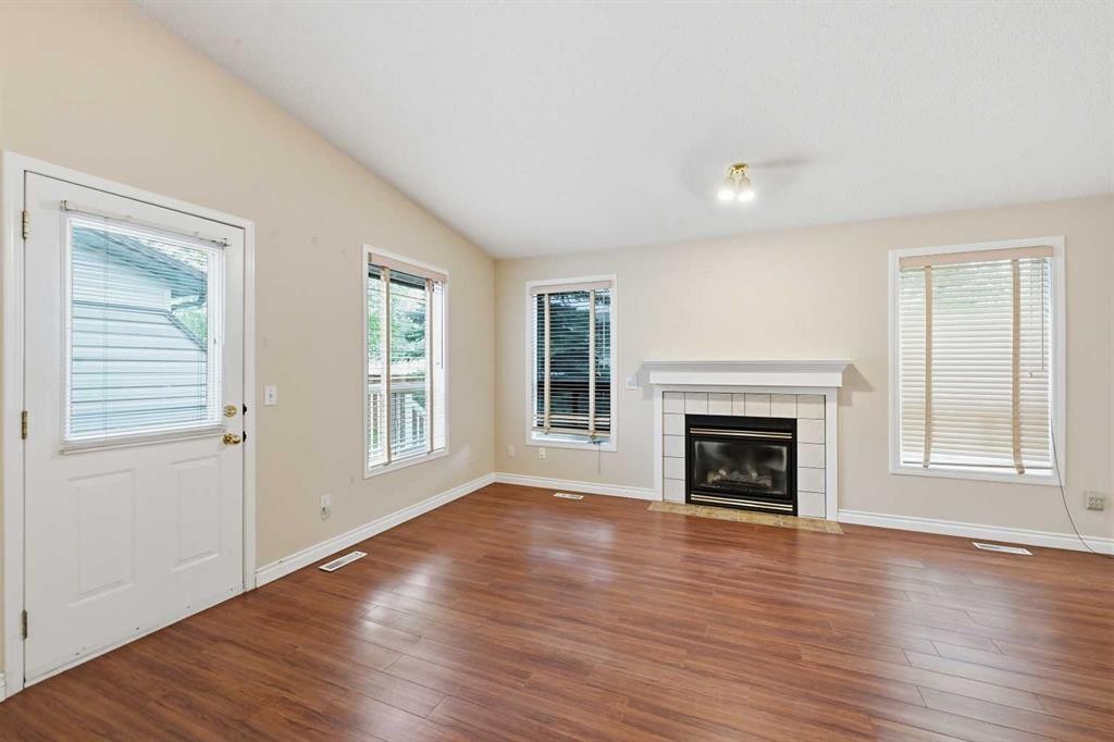 25 Tararidge Circle Ne, Calgary, AB - Indoor Photo Showing Living Room With Fireplace