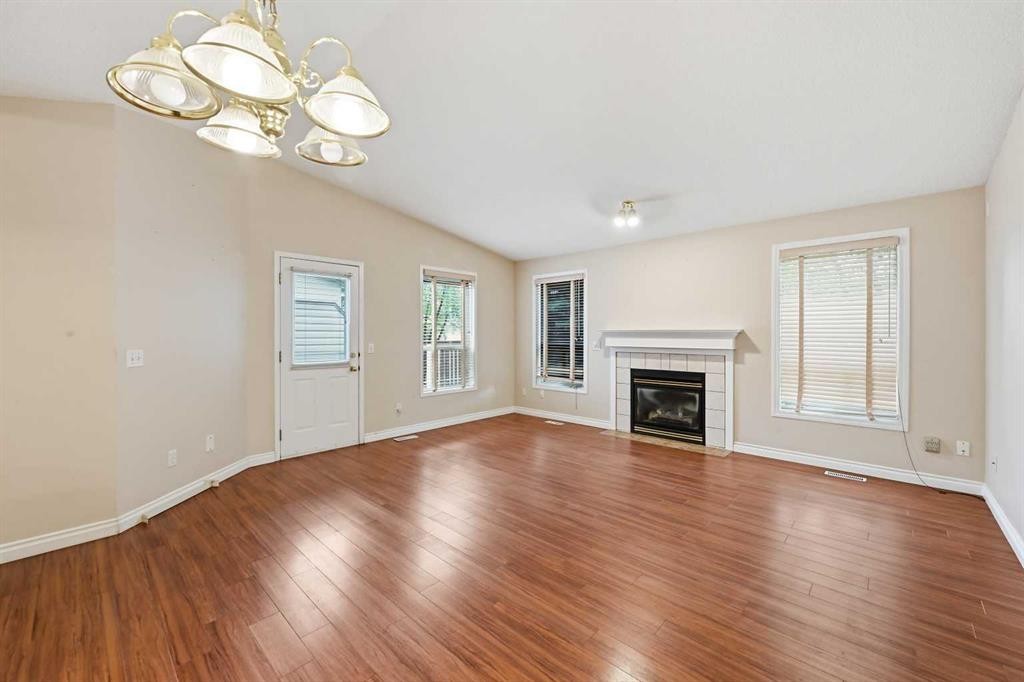 25 Tararidge Circle Ne, Calgary, AB - Indoor Photo Showing Living Room With Fireplace