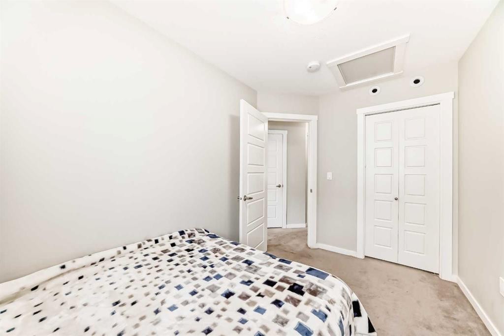 228 Red Embers Way Ne, Calgary, AB - Indoor Photo Showing Bedroom