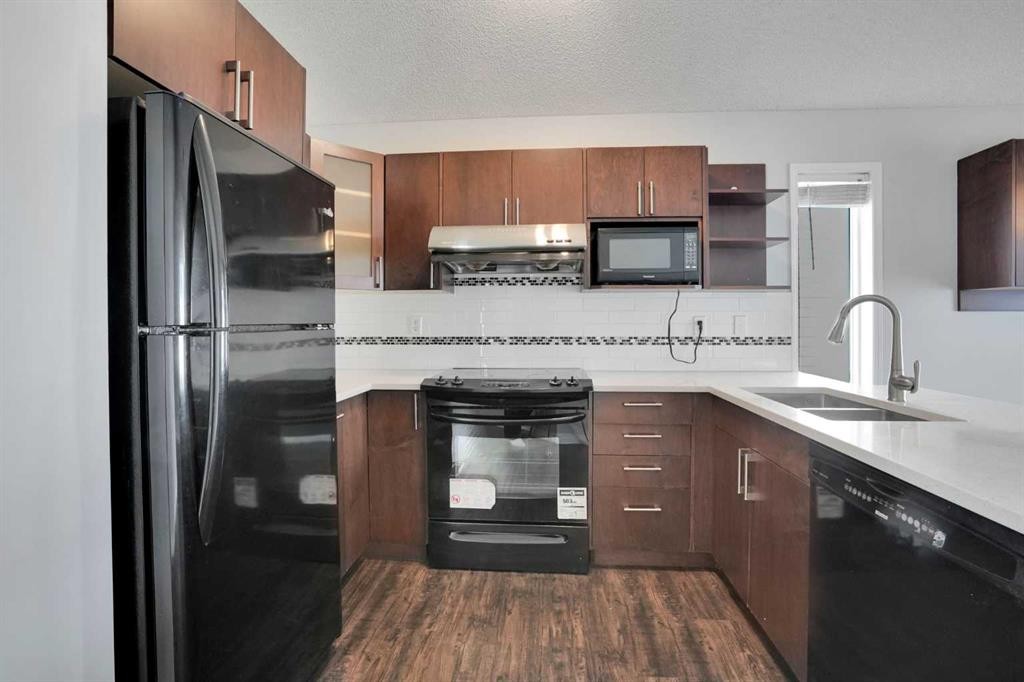42 Harvest Rose Circle Ne, Calgary, AB - Indoor Photo Showing Kitchen With Double Sink With Upgraded Kitchen