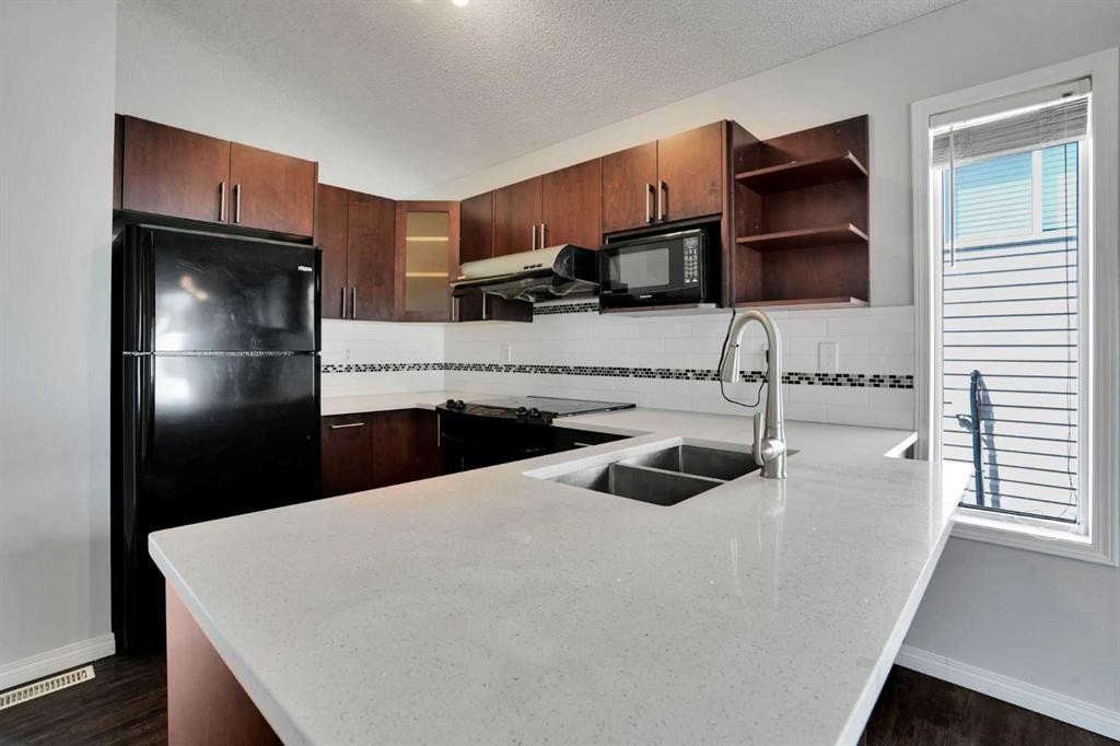 42 Harvest Rose Circle Ne, Calgary, AB - Indoor Photo Showing Kitchen With Double Sink