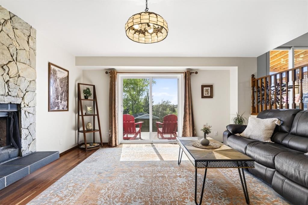 235 Deerview Drive Se, Calgary, AB - Indoor Photo Showing Living Room With Fireplace