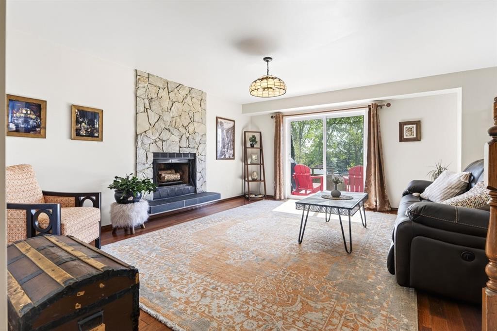 235 Deerview Drive Se, Calgary, AB - Indoor Photo Showing Living Room With Fireplace