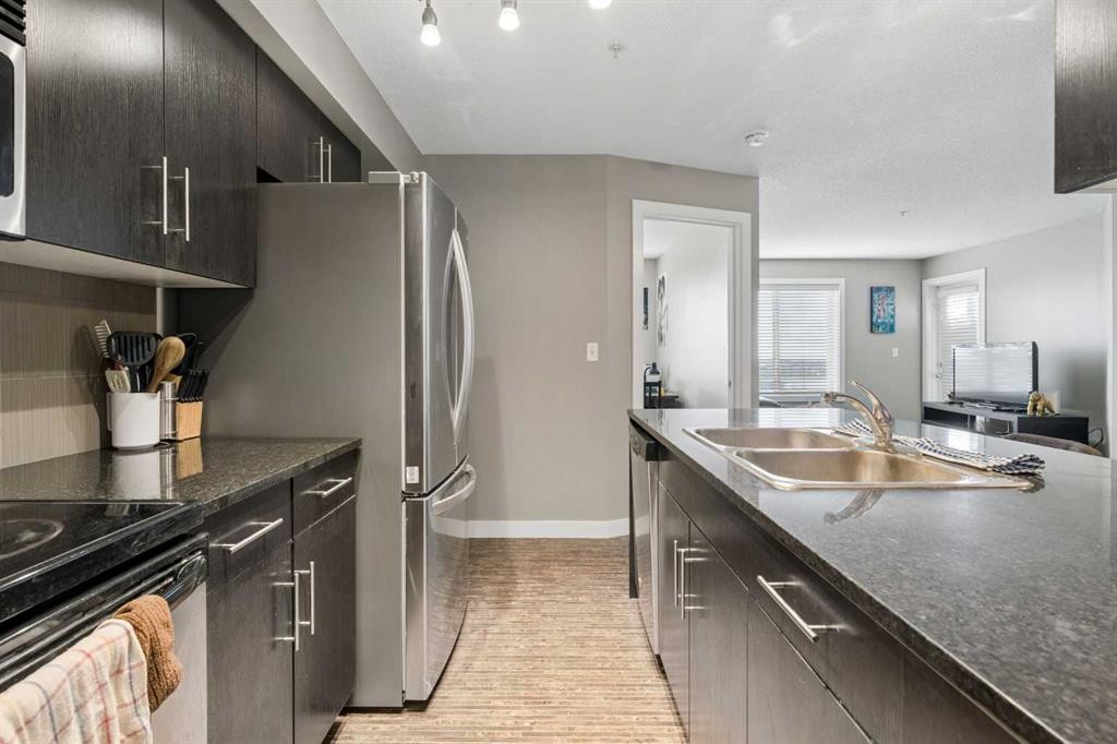 305-355 Taralake Way Ne, Calgary, AB - Indoor Photo Showing Kitchen With Double Sink
