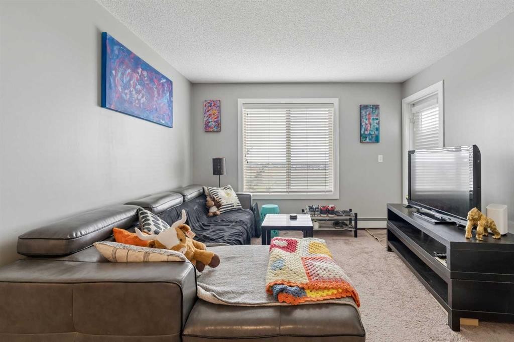 305-355 Taralake Way Ne, Calgary, AB - Indoor Photo Showing Living Room