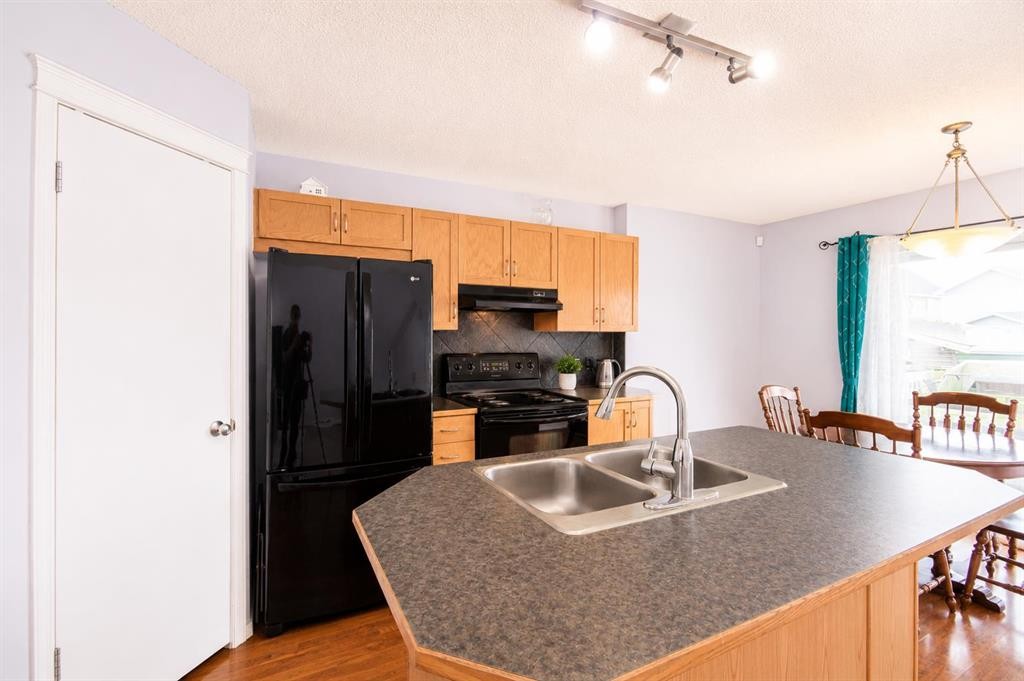 168 Prestwick Heights Se, Calgary, AB - Indoor Photo Showing Kitchen With Double Sink