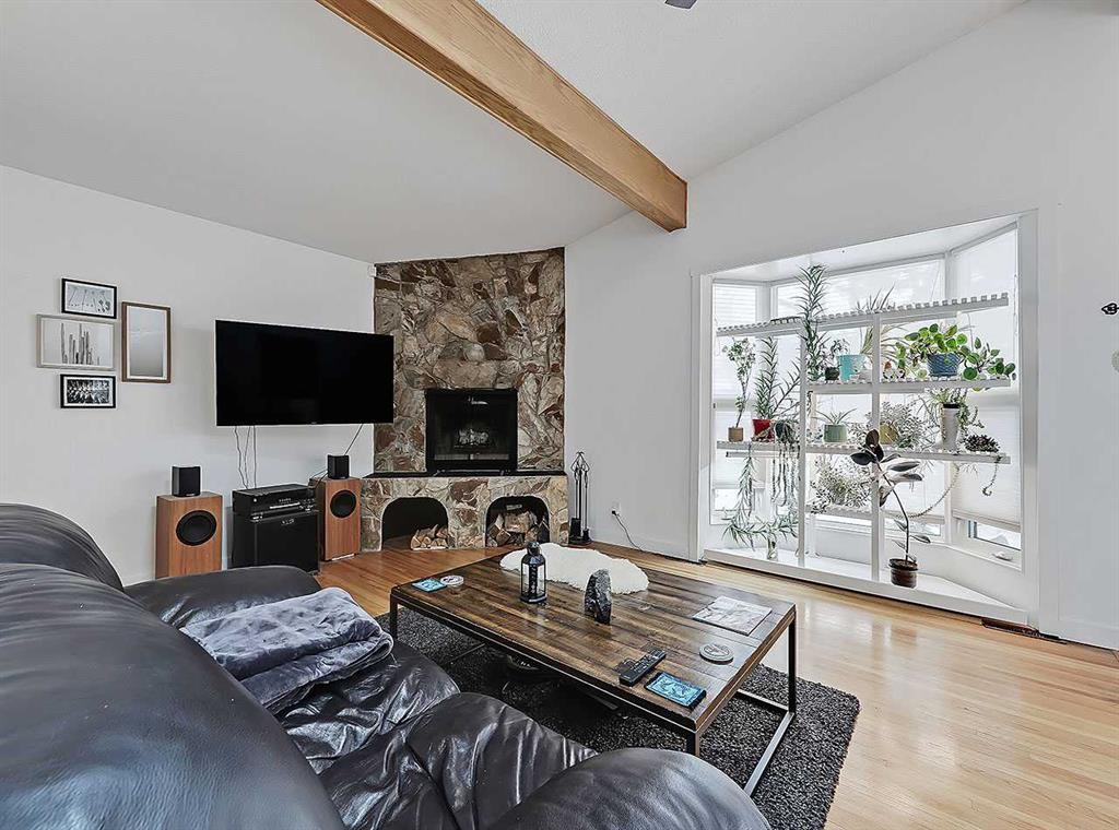247 Simons Road Nw, Calgary, AB - Indoor Photo Showing Living Room With Fireplace