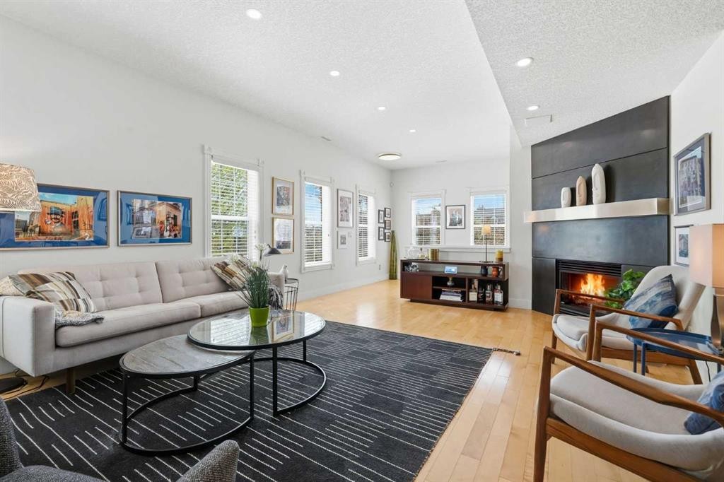 130 Garrison Square Sw, Calgary, AB - Indoor Photo Showing Living Room With Fireplace