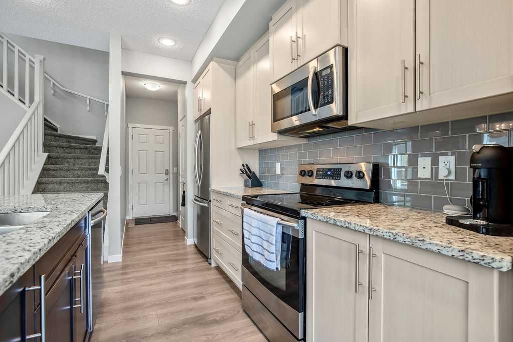 219 Mahogany Grove Se, Calgary, AB - Indoor Photo Showing Kitchen With Stainless Steel Kitchen With Upgraded Kitchen