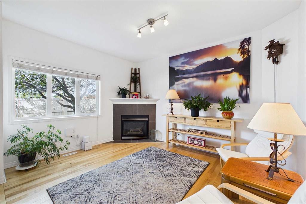 144 Simcoe Place Sw, Calgary, AB - Indoor Photo Showing Living Room With Fireplace