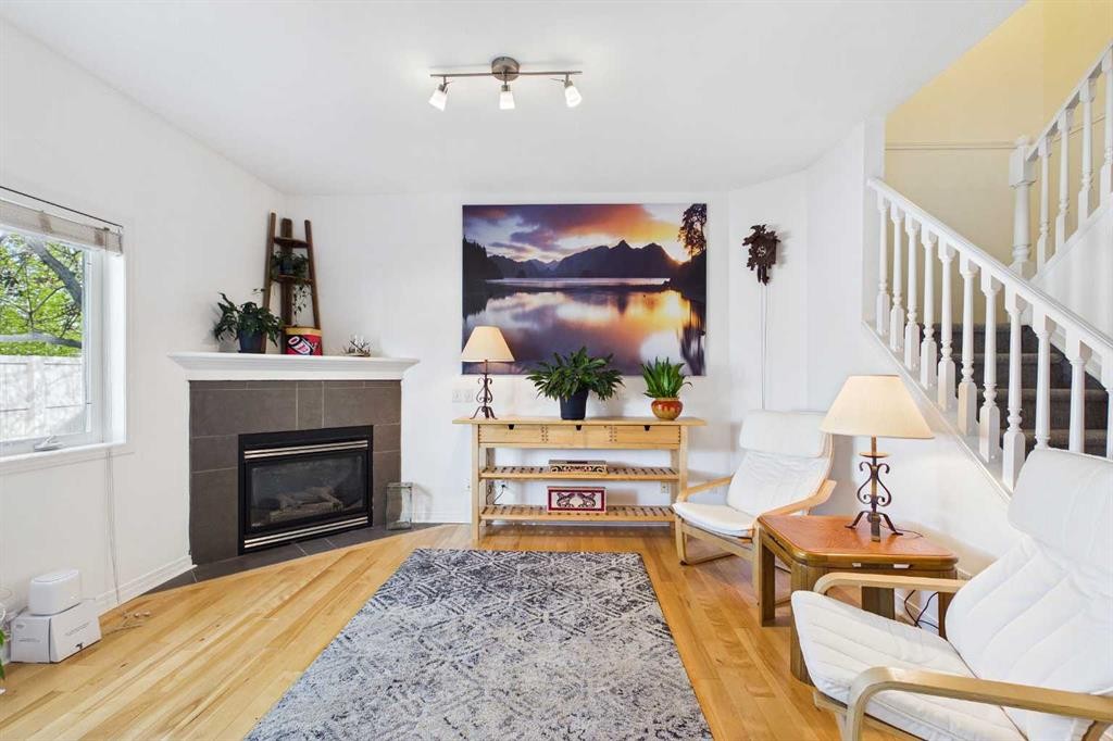 144 Simcoe Place Sw, Calgary, AB - Indoor Photo Showing Living Room With Fireplace