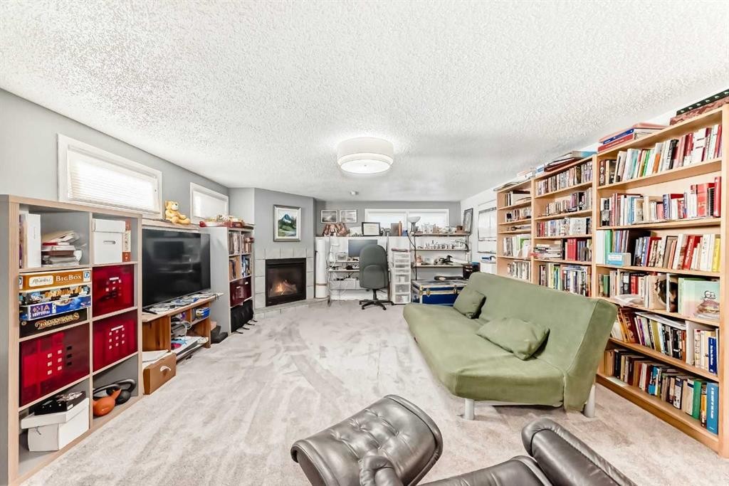 1319 104 Avenue Sw, Calgary, AB - Indoor With Fireplace