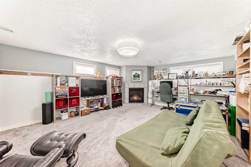 1319 104 Avenue Sw, Calgary, AB - Indoor With Fireplace