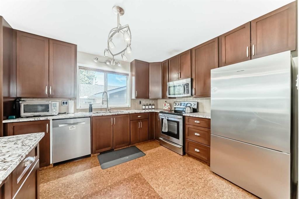 1319 104 Avenue Sw, Calgary, AB - Indoor Photo Showing Kitchen With Stainless Steel Kitchen