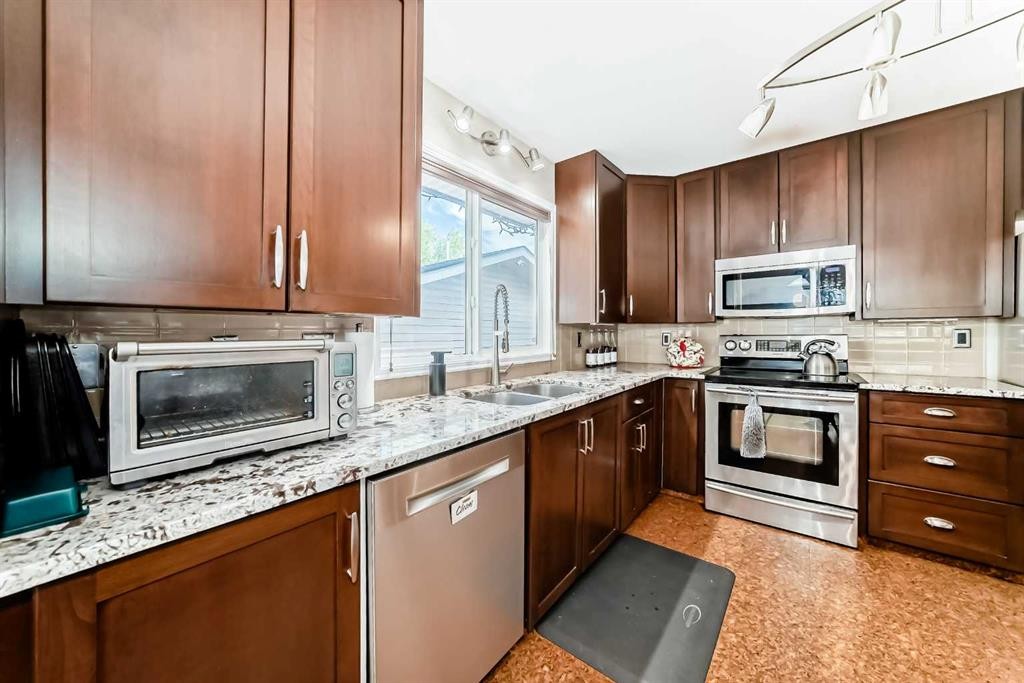 1319 104 Avenue Sw, Calgary, AB - Indoor Photo Showing Kitchen With Stainless Steel Kitchen With Double Sink