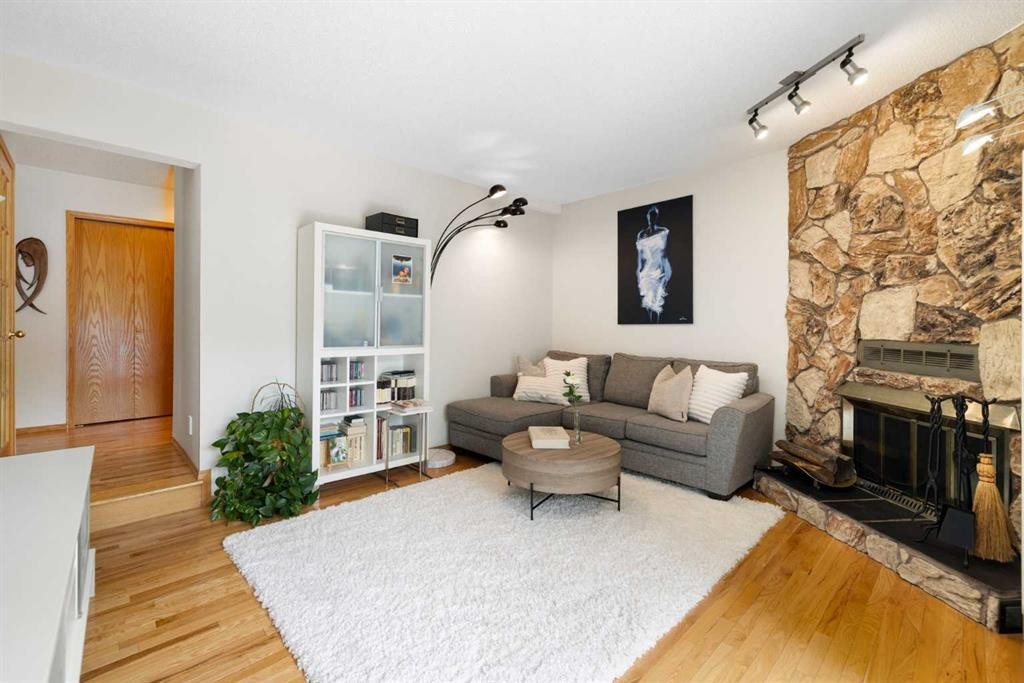 14207 Deer Run Boulevard Se, Calgary, AB - Indoor Photo Showing Living Room With Fireplace