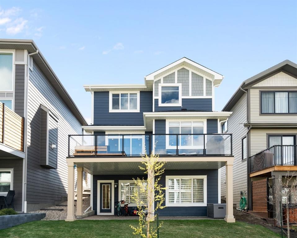75 Sundown Crescent, Cochrane, AB - Outdoor With Facade