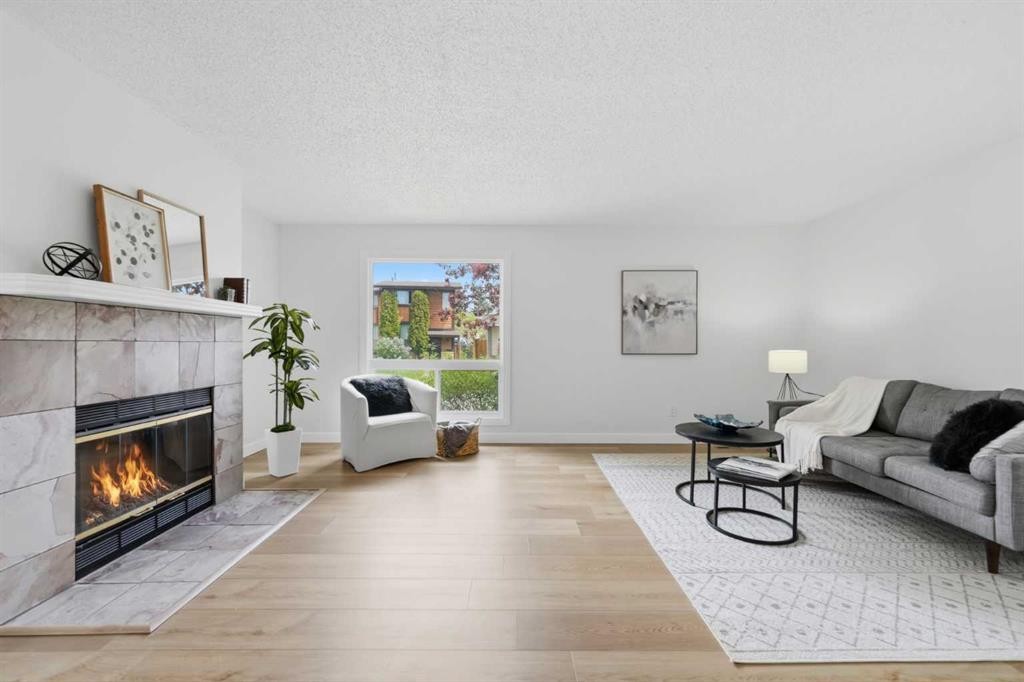 85 Cedarwood Hill Sw, Calgary, AB - Indoor Photo Showing Living Room With Fireplace