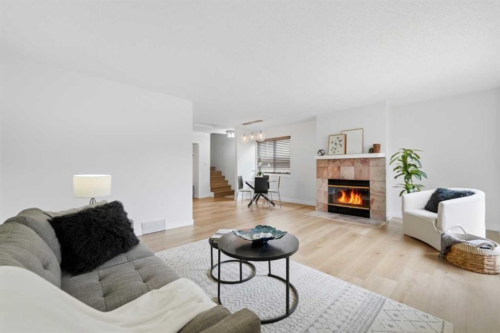 85 Cedarwood Hill Sw, Calgary, AB - Indoor Photo Showing Living Room With Fireplace