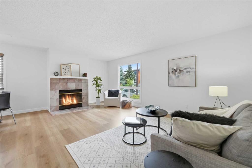 85 Cedarwood Hill Sw, Calgary, AB - Indoor Photo Showing Living Room With Fireplace