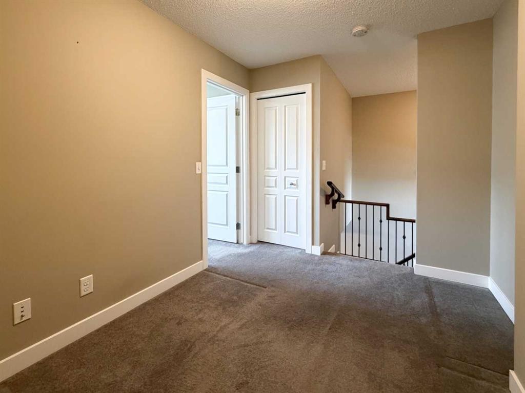 117 Panatella Hill Nw, Calgary, AB - Indoor Photo Showing Other Room