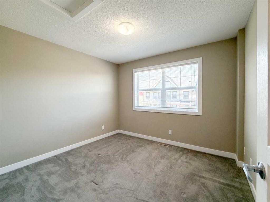 117 Panatella Hill Nw, Calgary, AB - Indoor Photo Showing Other Room