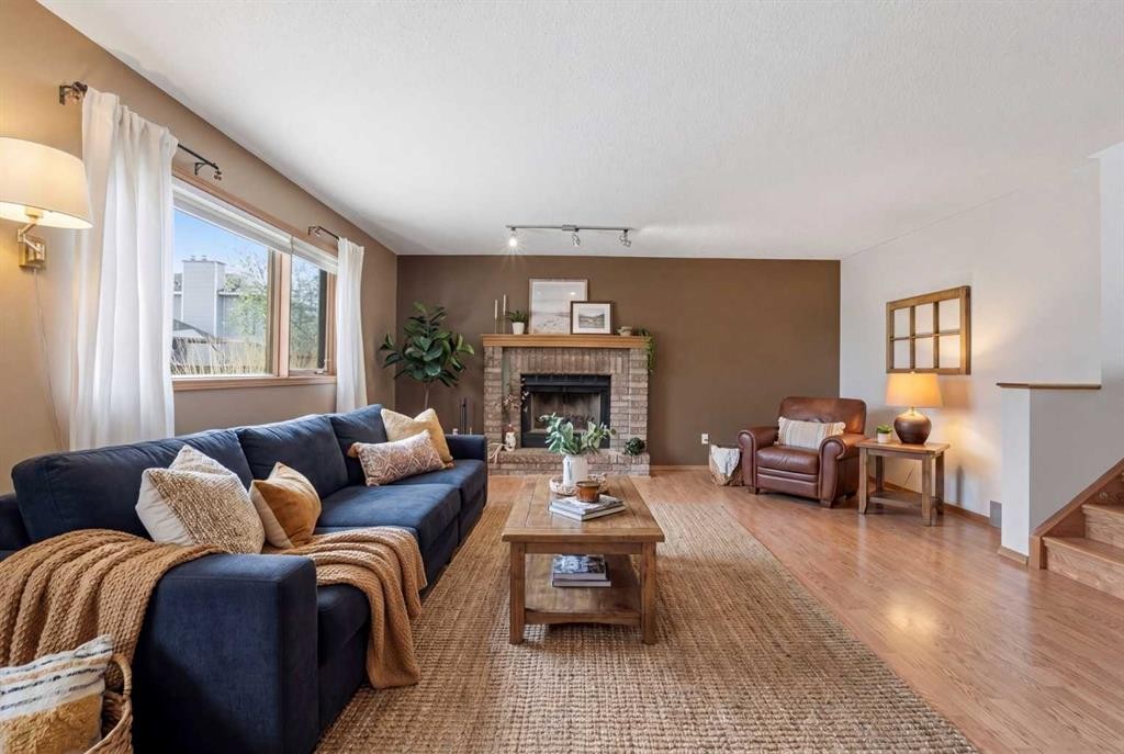 109 Downey Place, Okotoks, AB - Indoor Photo Showing Living Room With Fireplace