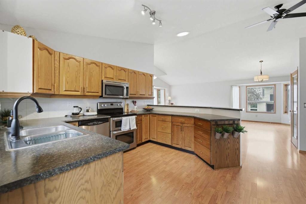 109 Downey Place, Okotoks, AB - Indoor Photo Showing Kitchen With Double Sink