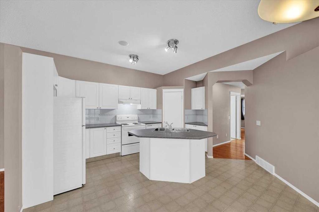 231 Tuscany Drive Nw, Calgary, AB - Indoor Photo Showing Kitchen With Double Sink