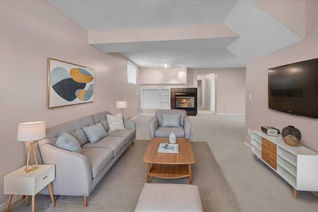 231 Tuscany Drive Nw, Calgary, AB - Indoor Photo Showing Living Room With Fireplace