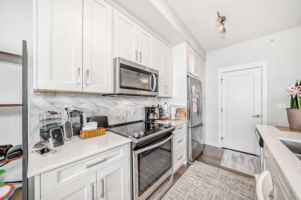 415-300 Auburn Meadows Common Se, Calgary, AB - Indoor Photo Showing Kitchen With Upgraded Kitchen
